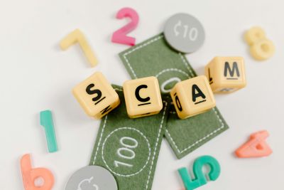 The word Scam spelled out in blocks