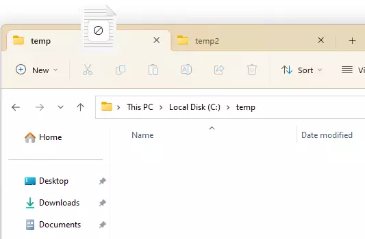 Screenshot of a dragged file on top of the tab it is being moved to