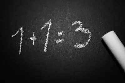 1+1 = 3 on a blackboard