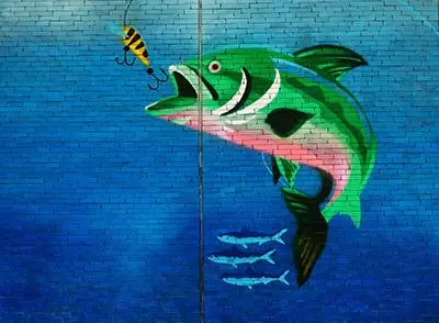 A fish leaping for a fishing hook