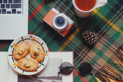 A plate of cookies near a Mac