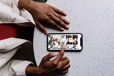 Someone browsing images on an iPhone