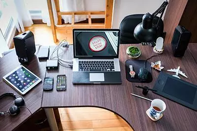 Many electronic devices arranged on a desk