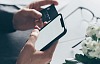 Someone about to put their credit card details into their phone