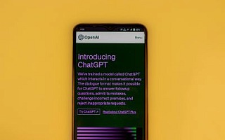 A mobile phone with the ChatGPT homepage open in a browser