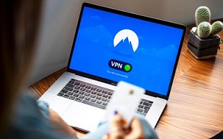 A laptop with a VPN graphic on the screen