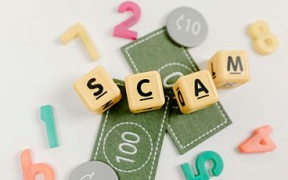 The word Scam spelled out in blocks